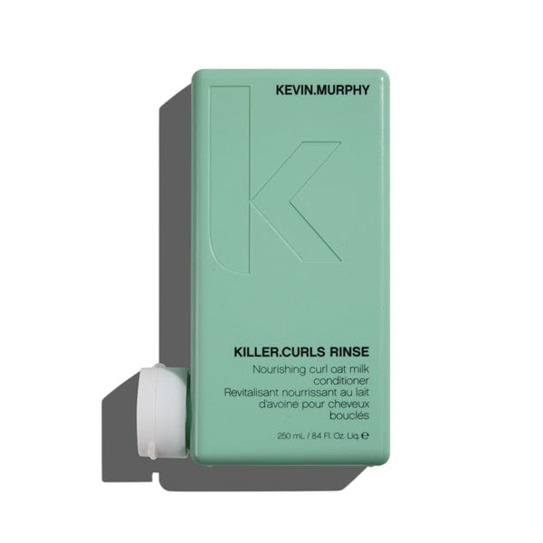 A bottle of Kevin Murphy Killer Curls Rinse conditioner with a teal label and a pump dispenser.