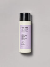 Pastel lavender label silicone-free conditioner to hydrate and define curls from an eco-friendly salon in Toronto