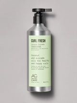 Pastel green label conditioner with coconut and avocado oils to define and strengthen curls from an eco-friendly salon in Toronto