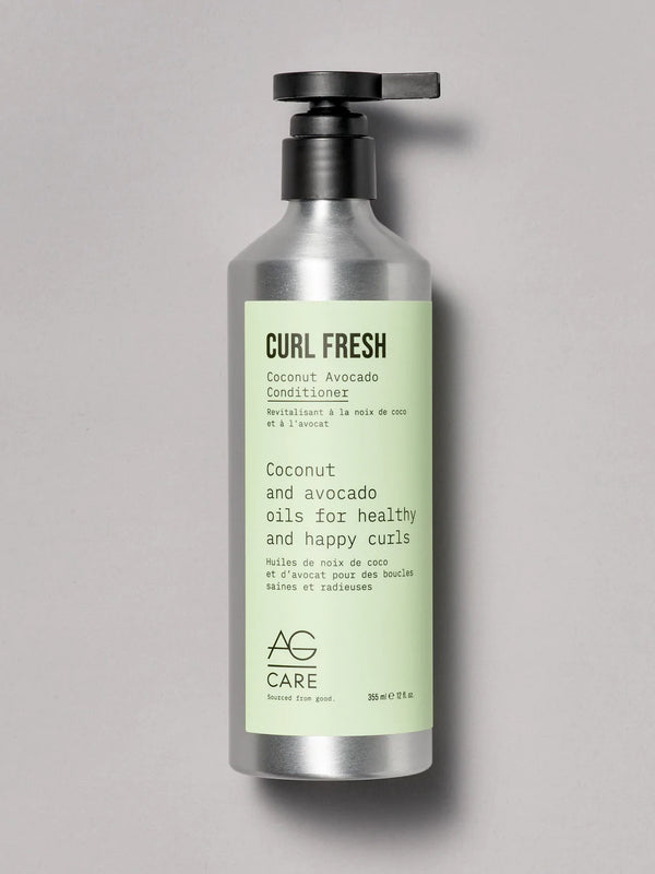 Pastel green label conditioner with coconut and avocado oils to define and strengthen curls from an eco-friendly salon in Toronto
