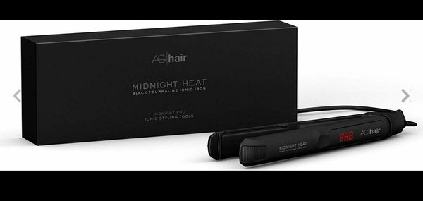 Black rectangular box with black tourmaline ionic flat iron from an eco-friendly salon in Toronto for smooth, frizz-free hair