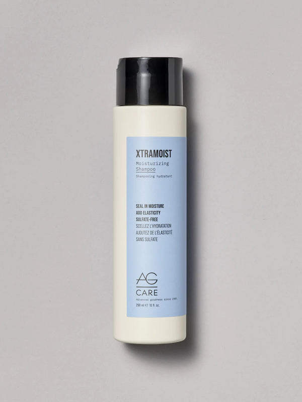 Pastel blue label hydrating shampoo with herbs and hyaluronic acid to seal moisture and add elasticity from an eco-friendly salon in Toronto