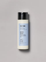 Pastel blue label leave-in conditioner with aloe and abyssinian oil from an eco-friendly salon in Toronto, frizz control