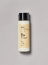 Pastel yellow label conditioner with coconut and argan oil to nourish and add shine from an eco-friendly salon in Toronto