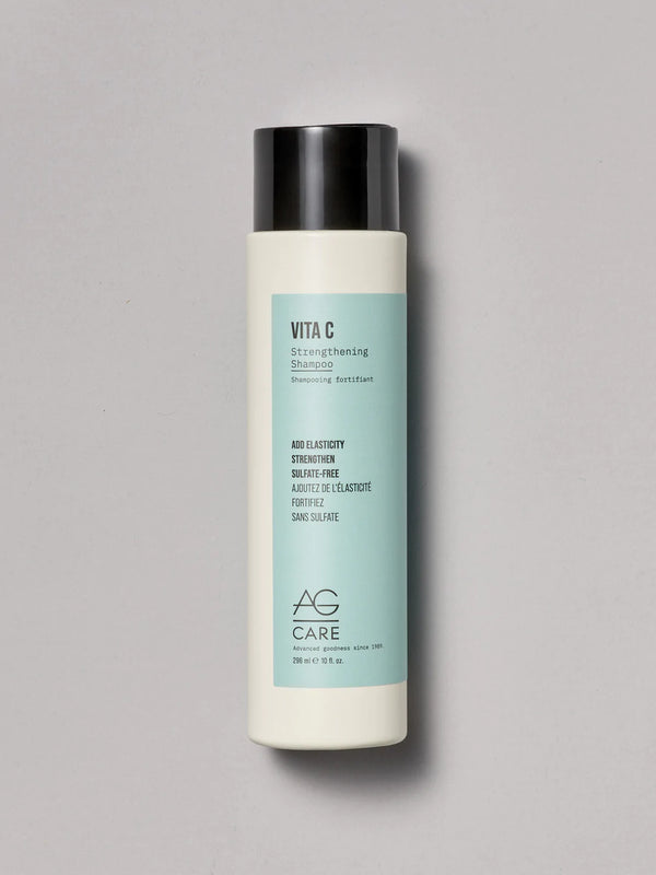 Pastel teal label strengthening shampoo with vitamin C and squalane from an eco-friendly salon in Toronto, sulfate-free