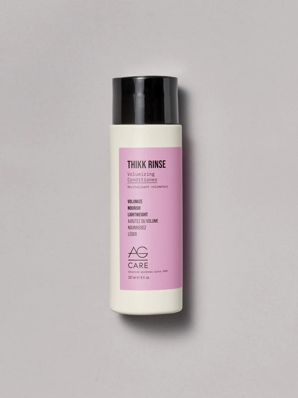 Pastel pink label volumizing conditioner with panthenol and pea sprout extract from an eco-friendly salon in Toronto