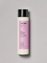Pastel pink label volumizing shampoo with panthenol and Regenerative Complex from an eco-friendly salon in Toronto, sulfate-free