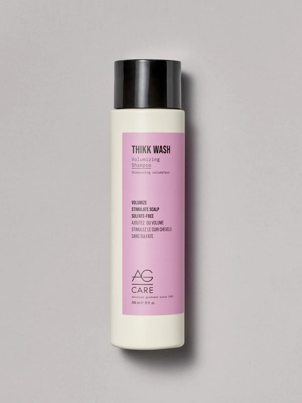 Pastel pink label volumizing shampoo with panthenol and Regenerative Complex from an eco-friendly salon in Toronto, sulfate-free