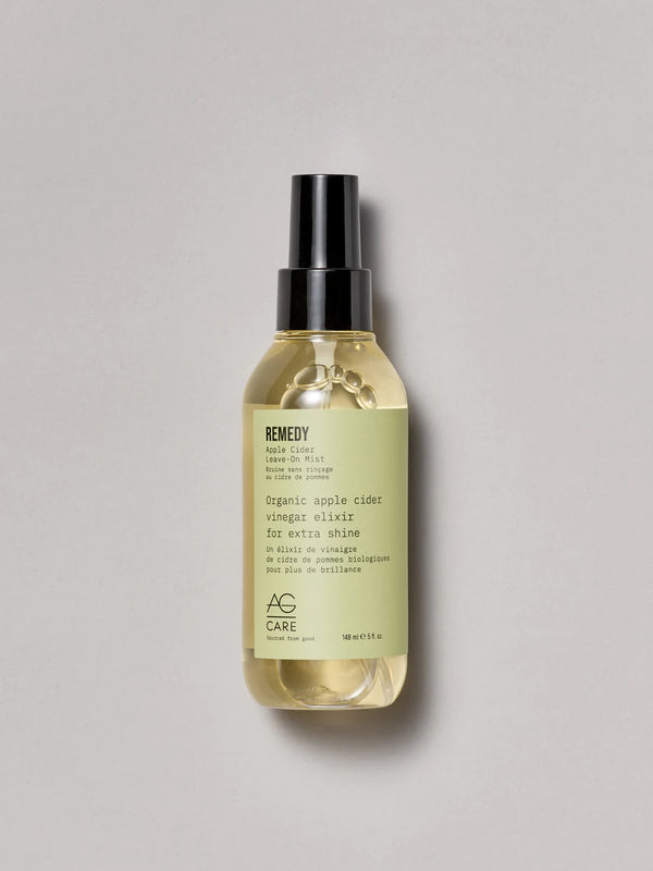 Clear bottle with pastel army green label, AG Apple Cider Vinegar Mist at Green Circle Salon Toronto. Adds shine, reduces frizz, and balances pH.