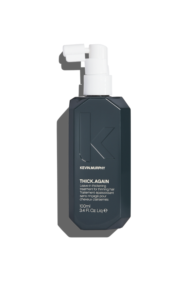 A sleek dark greyish green bottle with nozzle of Kevin Murphy Thick.Again leave-in treatment for thicker, fuller hair and heat protection