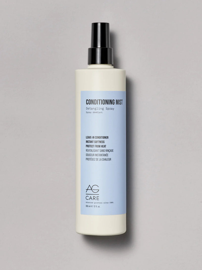 Bottle with baby blue pastel label, AG Leave-In Conditioner at Green Circle Salon Toronto. Softens, detangles, and protects with no residue.