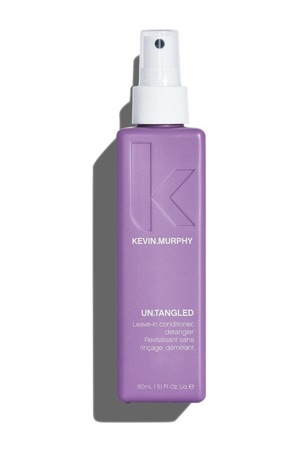 Light raisin bottle UN.TANGLED by Kevin Murphy at Green Circle Salon Toronto. Leave-in conditioner that detangles and protects hair.
